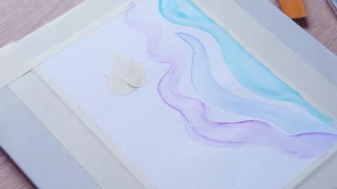 Female artist's hand draws with colored paints, blue, lilac waves, backgrou.. Stock Footage 252191269