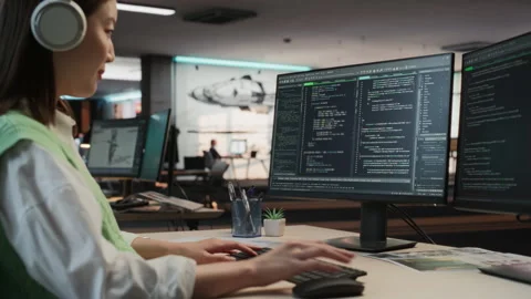 Female Asian Programmer Coding In Game Development Office Stock Footage 255795364