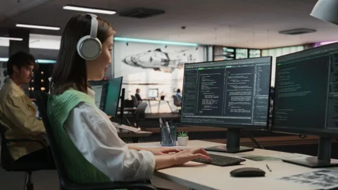 Female Asian Programmer Coding In Game Development Office Stock Footage 255795389