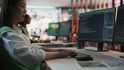 Female Asian Programmer Coding In Game Development Office Stock Footage 255796247
