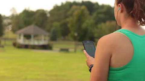 Female Athlete Checking Activity on Smart Phone 스톡 동영상 54175533