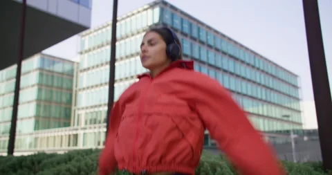 Female athlete does cardio training workout jumps high and clasps hands over Stock Footage 160209146