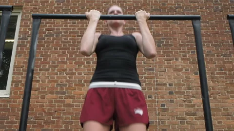 Female Athlete Doing Pull Ups Stock Footage 60667188