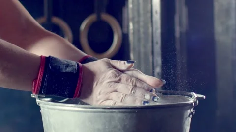 Female athlete hands clapping chalk powder preparing training workout. Stock Footage 148767366