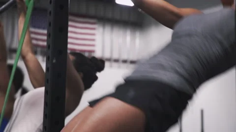 Female athlete performing butterfly pullups Stock Footage 66855962