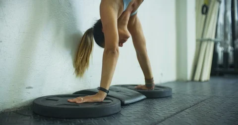 Female athlete performing headstand push ups Stock Footage 104018047
