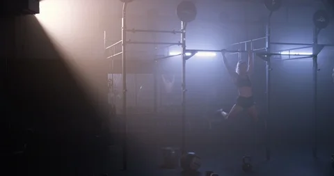 Female athlete performing pull ups Stock Footage 104004967