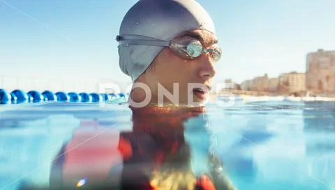 Female athlete in swim cap and goggles Stock Photos