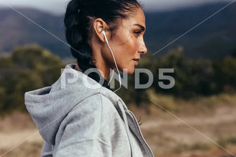 Female athlete taking a rest after workout Stock Photos