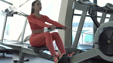 Female athlete training at exerciser Stock Footage 99212147