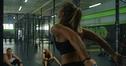 Female athlete training on a pull up bar Stock Footage 96961246
