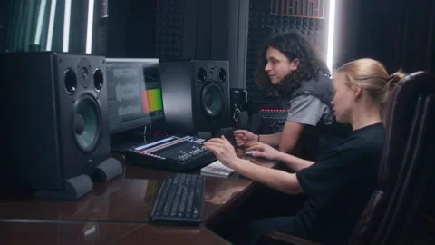 Female audio engineer and singer create song in recording studio 스톡 동영상 238993789