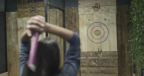 Female axe thrower missing the target Video stock 137823087