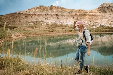 Female Backpacker Exploring Mountain Landscape Stock Photos