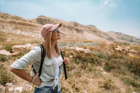 Female Backpacker Exploring Mountain Landscape Stock Photos