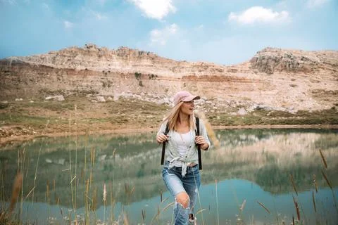 Female Backpacker Exploring Mountain Landscape Stock Photos