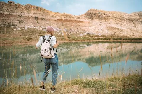 Female Backpacker Exploring Mountain Landscape Stock Photos