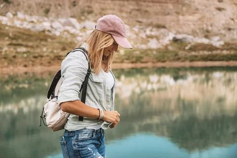 Female Backpacker Exploring Mountain Landscape Stock Photos