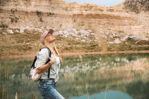 Female Backpacker Exploring Mountain Landscape Stock Photos