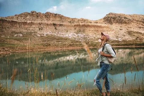 Female Backpacker Exploring Mountain Landscape Stock Photos