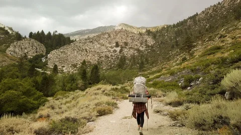 Female Backpacker Hiking in Cloudy High Sierra Mountain Range, Alpine California Stock Footage 116072568