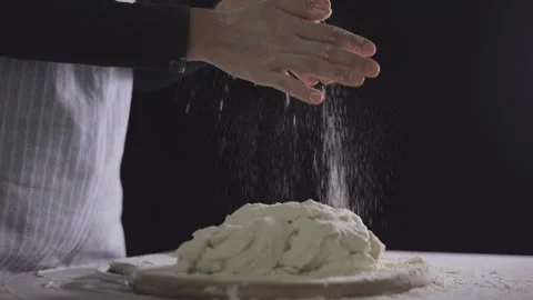 Female Baker clapping his hands filled with flour. Stock Footage 138577233