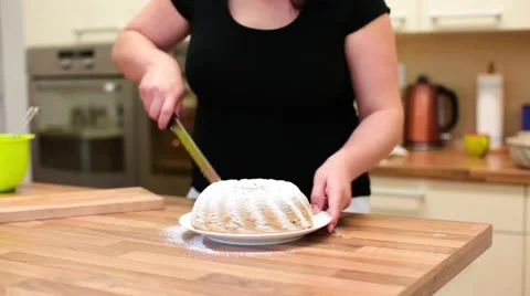 Female baker preparing a marble cake to be served Stock Footage 47935951
