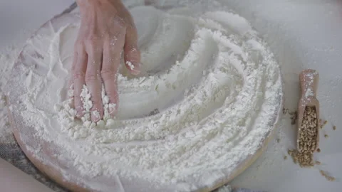 Female Baker touching flour on the table with hand. Stock Footage 138566552