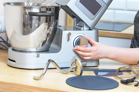 Female Baker Using Digital Kitchen Machine Stock-Fotos