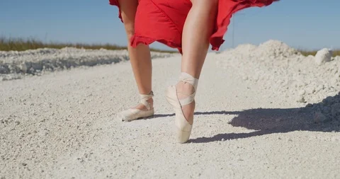 Female ballet dancer performing her routine on a country road Stock Footage 107683264