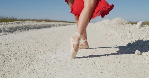Female ballet dancer performing her routine on a country road Stock Footage 107683679