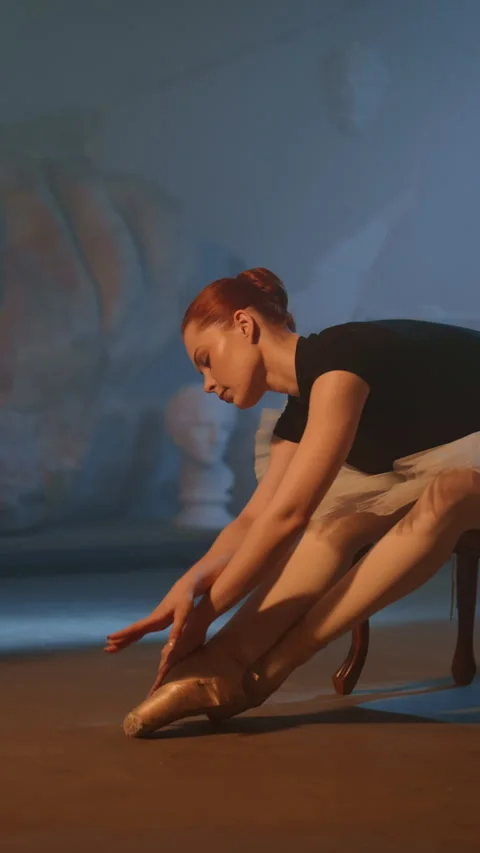 Female ballet dancer stretch body before rehearsing, amazing slow motion shot. Stock Footage 341555976