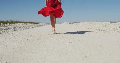 Female ballet dancer walking down country road Stock Footage 107671550