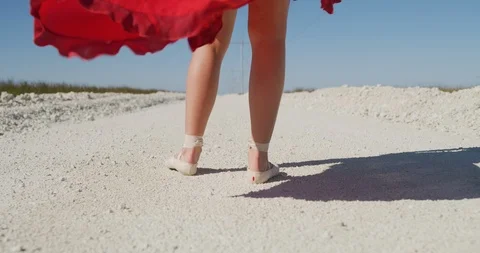 Female ballet dancer walking down country road Stock Footage 107671887