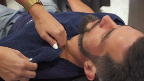 Female barber hands preparing customer before steam treatment Stock Footage 159880016