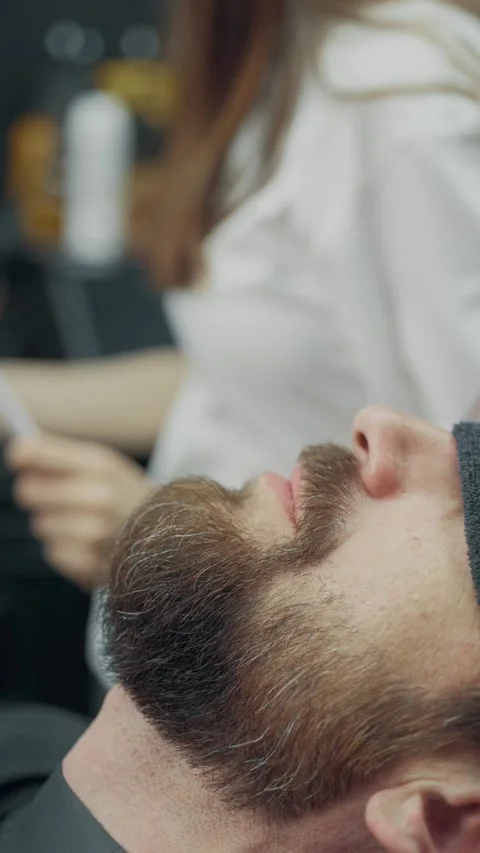 Female Barber Trimming Client Beard in Salon 스톡 동영상 336782585