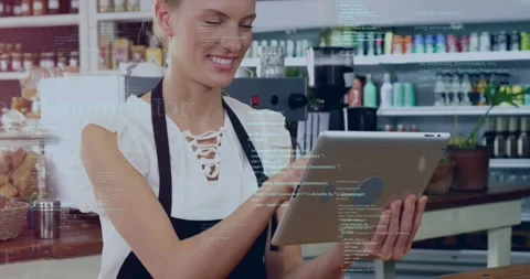 Female barista tapping tablet at cafe counter, initiating code overlay and Stock Footage 329870800