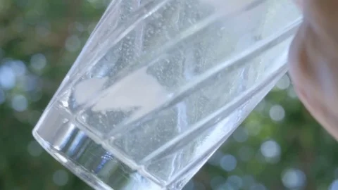 Female Bartender Makes a Martini in a Clear Cocktail Shaker Stock Footage 75879628
