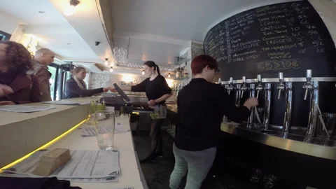 Female Bartender Pouring Beer Sample from Draft Taps Wide Angle Shot 스톡 동영상 346362045