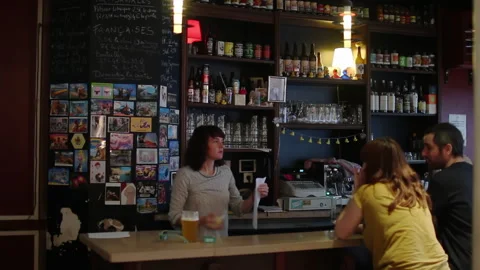 Female Bartender Serving Customers At Craft Beer Bar In Paris Video stock 344683354