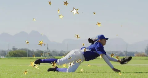 Female baseball player diving on grass field for marketing, with gold star Stock Footage 309035434
