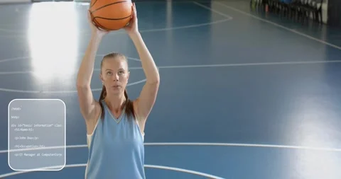 Female basketballer stabilizing ball causing tech code overlays cycling shooting Stock Footage 317406940