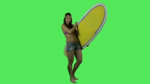 Female in bikini with surfboard Stock Footage 12141859