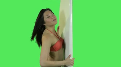 Female in bikini with surfboard Stock Footage 12141876