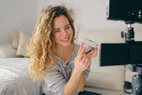 Female blogger recording makeup tutorial at home Foto stock