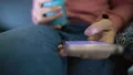 Female blogger scrolling smartphone photos, social network addiction, relax HD Footage