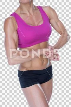 Female bodybuilder flexing in sports bra and shorts ~ Premium Photo  #245678644