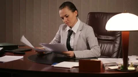 Female boss viewing documents Stock Footage 10957631