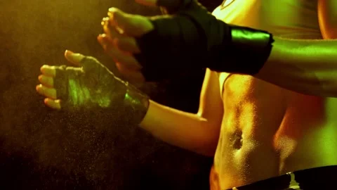 Female boxer clapping hands before fighting in slow motion. Close-up of young Stock Footage 198877782