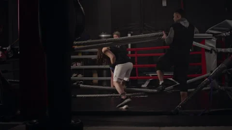 Female Boxer Entering Ring for Sparring Session with Trainer Stock Footage 340404717